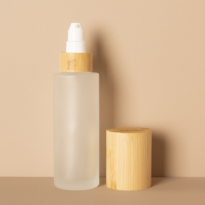 つや消し化粧品ローション ポンプ細かいミストと竹木の蓋が付いているローションのガラス スプレー ボトル つや消し化粧品ローション ポンプ細かいミストと竹木の蓋が付いているローションのガラス スプレー ボトル